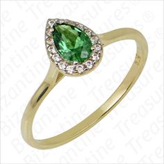 Discover elegance and sophistication with our 14K Gold Tear-Shaped Solitaire Ring featuring an exquisite Emerald stone and complemented by sparkling Zircon accents. Crafted with meticulous attention to detail, this ring exudes timeless beauty and luxury. The tear-shaped design adds a unique and graceful touch, making it a perfect choice for special occasions or as a meaningful gift.  Material: Crafted from luxurious 14K gold, this tear-shaped solitaire ring showcases a stunning Emerald stone and Elegant Pear-shaped Cubic Zirconia Emerald Ring, Elegant Teardrop Diamond Ring With Accent Stones, Elegant 14k Gold Emerald Ring With Pave Setting, Gold Emerald Ring With Pave Setting For Wedding, Elegant Green Birthstone Ring With Diamond Accents, May Birthstone Ring With Diamond Accents For Formal Occasions, Formal May Birthstone Ring With Diamond Accents, Elegant Teardrop May Birthstone Ring, Ring With Emerald Stone