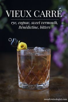 a close up of a drink in a glass on a table