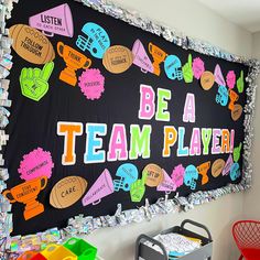 a bulletin board that says be a team player with lots of different things on it