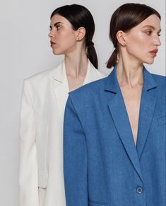 two models in blue blazers and white blazers, one with her hair pulled back