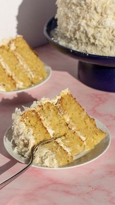 two plates with slices of cake on them, one has a fork in it and the other is half eaten