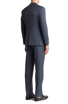 A refined two-button suit cut in a trim silhouette is the perfect go-to for any well-dressed event. 36.4" inseam; 7.8" leg opening; 10.6" rise (size 36) Jacket has notched lapels; chest welt pocket; dual flap welt pockets
 Lined 73% polyester, 25% rayon, 2% spandex
 Dry clean
 Imported Model stats: 6'1" height, 32" waist. Model is wearing size 36. Semi-formal Notch Lapel Pantsuit With Button Closure, Blue Notch Lapel Tuxedo For Work, Blue Three-piece Suit With Welt Pockets For Work, Single Button Notch Lapel Suits For Office Wear, Blue Suits With Notch Lapel And Hidden Button Closure, Three-piece Suit With Double Button Closure And Notch Lapel, Blue Double Breasted Suit With Pressed Crease For Work, Tailored Notch Lapel Pantsuit For Semi-formal Occasions, Formal Blue Suit With Double Button Closure