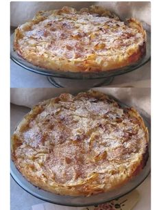 two pies sitting on top of pans covered in powdered sugar