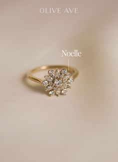 an image of a gold ring with diamonds on it and the words noodlee written in