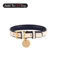 a white and blue leather dog collar with a gold plated charm on the clasp