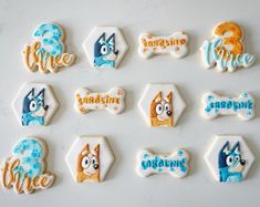 decorated cookies are arranged in the shape of dogs