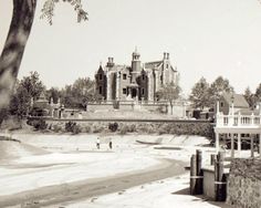 an old black and white photo of a castle