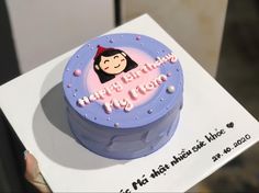 a birthday cake with a woman's face on it