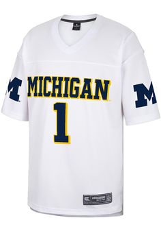 Get a piece of the Michigan Wolverines action with this Michigan Wolverines White  No 1 Football Jersey. You'll look like one of the team as you wear this Jersey to support your Wolverines. With a screen printed team name and number on the front, team mascot name and number on the back, with team logo on sleeves, this Football Jersey makes a great addition to any Wolverines fan's closet. Front and Back Yoke, Mesh, Woven Locker Tag, Team name printed on front, Team logo printed on sleeves, Fit: T Sporty White Tops With Mascot, Collegiate White Activewear For Sports, Sporty Mascot Tops For Sports, Sporty Mascot Top For Sports, White Collegiate Moisture-wicking Activewear, Moisture-wicking Fan Gear Jersey, Moisture-wicking Fan Apparel Jersey, Collegiate Moisture-wicking Jersey For Fan Gear, Michigan Wolverines Svg