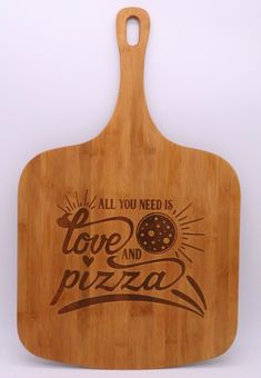 a cutting board with the words love and pizza on it