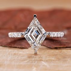 an engagement ring with a princess cut diamond