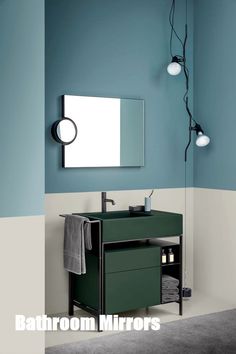 a bathroom with blue walls and green vanity