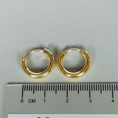 16 mm sterling silver endless ear hoops, dipped in gold. Size: 3 x 16 mm These earrings are made of real 925 hypoallergenic sterling silver, dipped in real gold. Will be packaged in a gift box. Please let me know if you don't want it in one. I can write out a message from you to the receiver if needed. Please be free to contact me at... bhavnakwintra1956@gmail.com More hoops: https://www.etsy.com/your/shops/TheSilverGame/tools/listings/section:26305414 More earrings: https://www.etsy.com/your/sh Simple Gold Huggie Jewelry, Simple Gold Huggie Earrings As Gift, Gold Simple Design Huggie Jewelry, Gold Huggie Jewelry With Simple Design, Simple Gold Huggie Hoop Earrings, Simple Gold Small Hoop Huggie Earrings, Simple Round Gold Huggie Earrings, Simple Gold Hoop Jewelry, Minimalist Small Hoop Earrings Cadmium-free