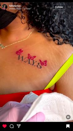 the back of a woman's chest with her name tattooed on it