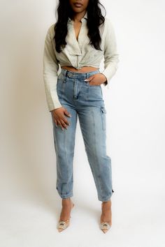 Crafted to make a statement, these cargo jeans offer a relaxed fit for all-day comfort. Create a polished look by styling them with a pair of statement heels or switch to a pair of sneakers to keep it more casual. SIZE & FIT Model is wearing a size small FEATURES Side cargo pockets Bottom cuff button closure Front seam detail Back pockets DETAILS 100% Cotton CARE Hand wash cold; Do not bleach; Line dry; Do not dry clean Denim Cargo Pants, Pants Large, Cargo Pant, Cargo Jeans, Pocket Detail, Polished Look, Crafts To Make, Fitness Models, Scarf Accessory