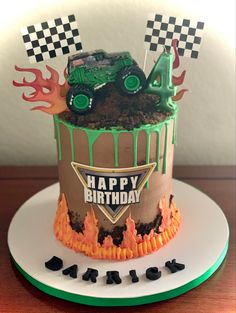 a monster truck birthday cake on a plate