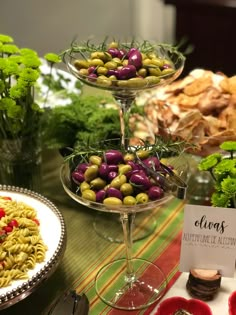 three tiered trays filled with different types of food on top of a table