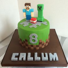 a green cake with the number 8 on it