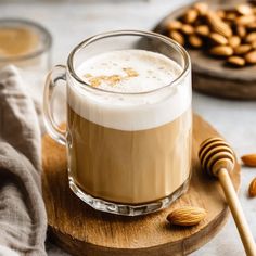 a glass mug filled with coffee and nuts