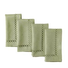 four linen napkins with criss cross stitching on the edges, in pale green