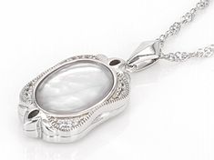 White Mother-of-Pearl Doublet with 0.08ctw White Zircon Rhodium Over Sterling Silver Locket Pendant w/Chain. Pendant measures approximately 1 1/8" L x 5/8" W and has a 1.5mm bail. Singapore chain measures approximately 18 inches in length, 1/32 of an inch in width with a lobster claw clasp closure and a 2-inch extender. Colors, shapes, and sizes may vary. Accent stones primarily zircon. Wedding Diamond Locket Jewelry, Elegant Diamond Locket Jewelry, White Gold Oval Pearl Pendant Jewelry, Elegant Locket Jewelry For Anniversary, Silver Oval Pearl Necklace, Anniversary Silver Pearl Gemstone Necklace, Silver Gemstone Pearl Necklace For Anniversary, Pearl White Oval Jewelry For Anniversary, Pearl White Oval Jewelry For Wedding