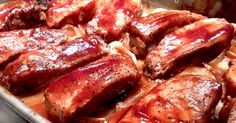 the meat is covered in sauce and ready to be cooked on the grill or oven