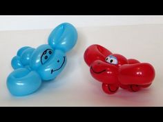 two balloons with faces on them sitting next to each other in the shape of an elephant