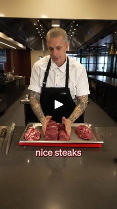 a man standing in front of a counter with raw meat on it and the caption nice steaks