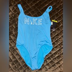 New With Tags ! Xl Nike Blue Sporty Swimwear, Nike Swimwear For Beach Season And Pool, Nike Swimwear For Pool And Beach Season, Nike Sleeveless Swimwear For Pool, Nike Sleeveless Swimwear, Nike Beach Swimwear, Casual Blue Nike Swimwear, Blue Summer Sports Bodysuit, Blue Sports Bodysuit For Summer