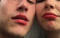 two people with their faces close to each other