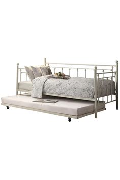 a metal bed frame with a pull out trundle and pillows on the bottom