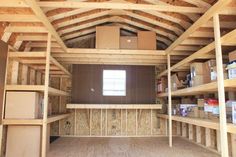 the inside of a storage room with shelves and boxes