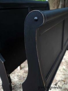 the back end of a black bed frame