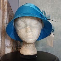 An Aquamarine Bucket Hat Accentuated With A Flower Bow And Black Feathers 100%Polyester Nwt Size:Os Blue Fedora Sun Hat For Kentucky Derby, Blue Adjustable Cloche Hat For Summer, Blue Mini Hats With Curved Brim For Beach, Blue Fedora Sun Hat - One Size Fits Most, Blue Mini Hat With Curved Brim For Beach, Blue Curved Brim Mini Hat For Beach, Blue Fedora Hat One Size Fits Most, Casual Blue Sun Hat For Kentucky Derby, Blue Mini Hats For Beach With Short Brim