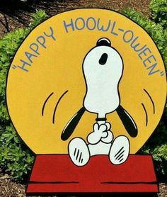 a sign that says happy hooli - oeuen with a cartoon dog on it