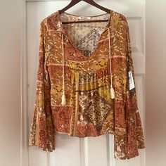 Beautiful Bell Sleeved Rip Curl Boho Blouse! Nwt!! Runs Oversized! Ptp 20” Bohemian Patterned Tops For Fall, Boho Print Tops For Fall Vacation, Fall Vacation Boho Print Top, Brown Flowy V-neck Top, Casual Patterned Peasant Top For Fall, Fall Boho Print V-neck Tops, Boho Print Long Sleeve Beach Top, Long Sleeve Boho Print Top For Beach, Fall Beach Printed Peasant Top