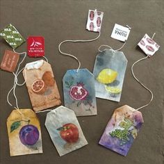 several tags with fruit and vegetables on them are laid out in the shape of bags