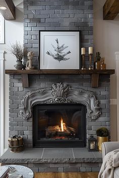 a living room with a fire place and pictures on the fireplace mantel above it