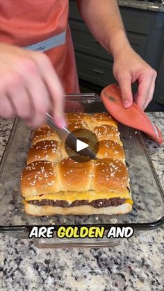 a person cutting up some food on top of a pan with a carrot in it