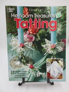 the cover of crochet magazine shows an image of flowers and candles with lace on them