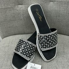 Nwt Black And Rhinestone Slide In Sandals. Black Bling Sandals For Summer, Summer Black Sandals With Bling, Glamorous Bedazzled Black Sandals, Glamorous Black Sandals With Bling, Black Bling Sandals For The Beach, Black Bling Sandals For Night Out, Beach Sandals With Bling In Black, Beach Bling Black Sandals, Black Embellished Sandals For Summer