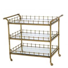 three tiered brass serving cart with glass shelves and metal bars on the bottom shelf