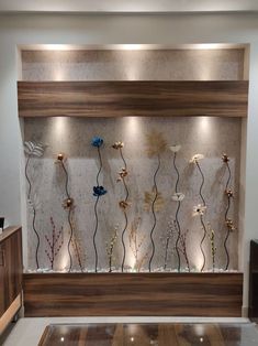 a wall mounted with flowers and lights in a living room or dining room, as well as an entertainment center