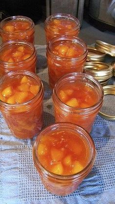 several jars filled with food sitting on top of a table