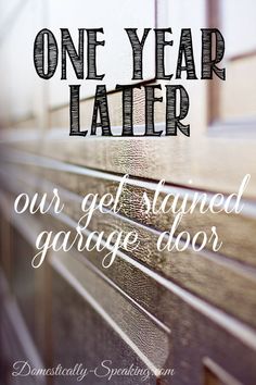 a door with the words, one year later our get started garage door written on it