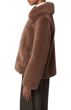 Bring a luxurious look to your cold-weather ensembles with this zip-front jacket crafted from plush faux fur and topped with an oversized collar. 25" length (size Medium) Front zip closure Spread collar Front welt pockets Lined 100% polyester faux fur Dry clean Imported Faux Fur Outerwear With Zipper, Faux Fur Outerwear With Zipper Closure, Faux Fur Outerwear With Zipper Closure And Long Sleeves, Faux Fur Long Sleeve Mink Outerwear, Fluffy Mink Long Sleeve Outerwear, Mink Color Long Sleeve Faux Fur Outerwear, Mink-colored Long Sleeve Faux Fur Outerwear, Fluffy Mink-colored Long Sleeve Outerwear, Winter Faux Fur Coat With Zipper Closure