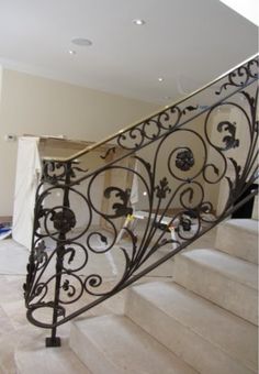 an iron stair railing in the middle of a room