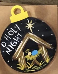 a cardboard box with a nativity ornament on it