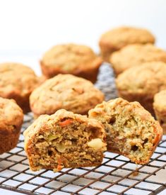 muffins on a cooling rack with one cut in half to show the inside