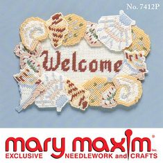 a close up of a sign on a wall with the words welcome to mary maximum